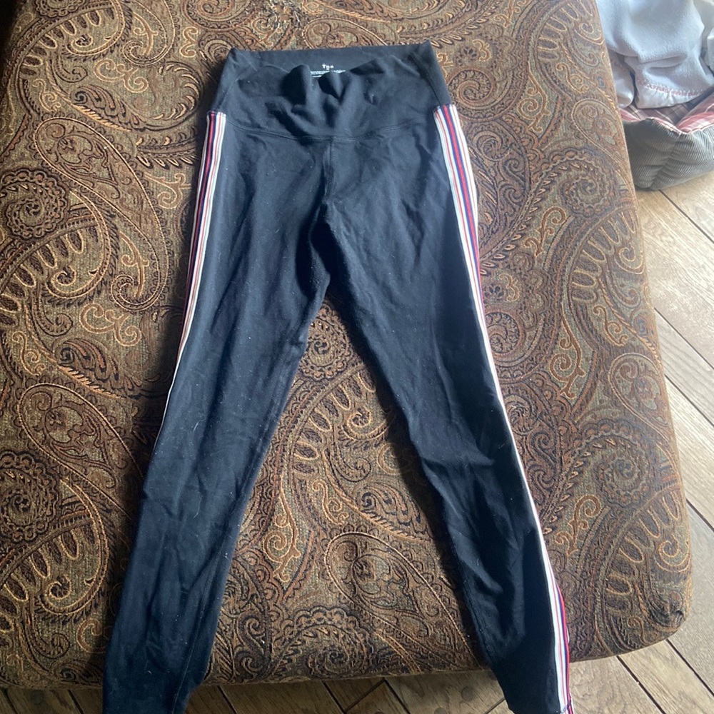 Size medium. Black with stripes on side.